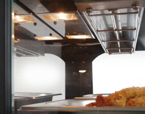 Warmhaltevitrine mit Quartzheizung, 2 Auslagen. Gehärtetes Glas an den Seiten, geschwungene Glastüren